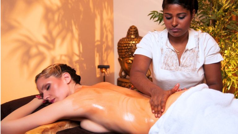 A woman getting Abhyanga massage which is one the many ayurvedic therapies